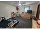 This bedroom features a ceiling fan, carpet, natural light, and plenty of space for play, perfect for children at 2239 Chevelle Ct, Anderson, IN 46012