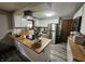 Kitchen featuring white cabinets, butcher block countertops, stainless appliances and a garden window for natural light at 2239 Chevelle Ct, Anderson, IN 46012