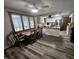 Eat-in kitchen with white cabinets, wood countertops, stainless appliances, and a dining area at 2239 Chevelle Ct, Anderson, IN 46012