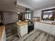 Charming kitchen featuring wood countertops, white cabinets, and modern stainless steel range at 2239 Chevelle Ct, Anderson, IN 46012