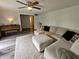 Inviting living room with a plush sectional sofa, hardwood flooring and a piano creating a cozy ambiance at 2239 Chevelle Ct, Anderson, IN 46012