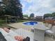 Backyard featuring a refreshing blue pool, outdoor dining and seating, and a grill at 2239 Chevelle Ct, Anderson, IN 46012
