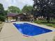 Backyard featuring a refreshing blue pool, outdoor seating, and a grill at 2239 Chevelle Ct, Anderson, IN 46012