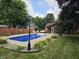 Backyard featuring a refreshing blue pool, outdoor seating and a fenced in yard at 2239 Chevelle Ct, Anderson, IN 46012