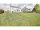 Spacious backyard with grass, wooden fence, and potential for outdoor activities at 2359 Seattle Slew Dr, Indianapolis, IN 46234