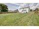 Expansive backyard with lush green grass, a wooden fence and a well-maintained lawn at 2359 Seattle Slew Dr, Indianapolis, IN 46234