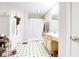 Bathroom featuring black and white tile flooring, a single vanity, and a shower-tub combo at 2359 Seattle Slew Dr, Indianapolis, IN 46234