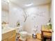 Half bathroom featuring unique wall art, wood flooring, and a charming vanity at 2359 Seattle Slew Dr, Indianapolis, IN 46234