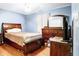 Comfortable bedroom featuring hardwood floors, natural light, and ample closet space at 2359 Seattle Slew Dr, Indianapolis, IN 46234