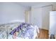 Comfortable bedroom featuring wood floors, a bright window and stylish decor at 2359 Seattle Slew Dr, Indianapolis, IN 46234