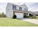 This property boasts an attached two-car garage and tasteful exterior brick and siding design at 2359 Seattle Slew Dr, Indianapolis, IN 46234