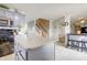 Open concept kitchen featuring a gray island, stainless appliances, and seamless flow to living spaces at 2359 Seattle Slew Dr, Indianapolis, IN 46234