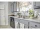 Bright kitchen boasts granite counters, stainless appliances, and a window overlooking the sink with a view at 2359 Seattle Slew Dr, Indianapolis, IN 46234