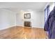 Bright living room features hardwood floors, decorative fireplace with mantel, with natural light streaming through the windows at 2359 Seattle Slew Dr, Indianapolis, IN 46234