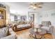Open-concept living room boasts hardwood floors, neutral paint, and abundant seating, perfect for entertaining at 2359 Seattle Slew Dr, Indianapolis, IN 46234