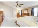 Bright main bedroom with neutral carpet, vaulted ceiling, and ample closet space at 2359 Seattle Slew Dr, Indianapolis, IN 46234