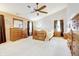Large main bedroom featuring natural lighting, wooden furniture, and a welcoming ambiance at 2359 Seattle Slew Dr, Indianapolis, IN 46234