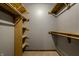 Well-organized walk-in closet with custom wood shelving, perfect for storage and organization at 2411 N Willow Way, Indianapolis, IN 46268