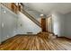 Spacious foyer with hardwood floors, staircase, and natural light, providing a warm welcome at 2411 N Willow Way, Indianapolis, IN 46268