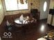 Cozy dining area featuring a round table with wooden chairs and natural light at 2610 Marywood Dr, Southport, IN 46227