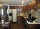 Classic kitchen with wooden cabinets and a vintage oven at 2610 Marywood Dr, Southport, IN 46227