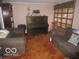 Comfortable living room featuring plush seating and a piano at 2610 Marywood Dr, Southport, IN 46227