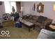 Comfortable living room with a sofa, chairs, and neutral carpet at 2610 Marywood Dr, Southport, IN 46227