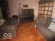 Cozy living room featuring comfortable seating and a piano at 2610 Marywood Dr, Southport, IN 46227