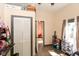 A cluttered bedroom featuring a door to the outside and a view of the street at 2702 S Moreland Ave, Indianapolis, IN 46241