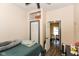 Comfortable bedroom featuring hardwood floors, closet and an open entrance to the dining room at 2702 S Moreland Ave, Indianapolis, IN 46241
