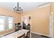 Bright dining room with hardwood floors, ample natural light, and an open view to the living area at 2702 S Moreland Ave, Indianapolis, IN 46241