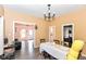 Open-concept dining area with hardwood floors, connecting to the living room and kitchen, great flow at 2702 S Moreland Ave, Indianapolis, IN 46241