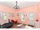 Bright and airy living room with hardwood floors, large windows, and comfortable seating, ideal for relaxation at 2702 S Moreland Ave, Indianapolis, IN 46241
