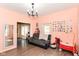 Cozy living room with hardwood floors, neutral walls, and bright natural light, ideal for relaxing at 2702 S Moreland Ave, Indianapolis, IN 46241