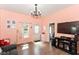 Bright living room featuring hardwood floors, natural light, and a welcoming entrance, perfect for entertaining at 2702 S Moreland Ave, Indianapolis, IN 46241