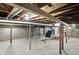 The basement features a concrete floor, exposed ductwork, and block walls ready for your personal touch at 2715 S A St, Elwood, IN 46036