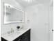 Bright bathroom features double vanity, large mirror, updated lighting and black hardware at 2715 S A St, Elwood, IN 46036