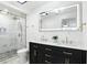 Modern bathroom with double vanity, stand alone shower with gold accents and updated fixtures at 2715 S A St, Elwood, IN 46036