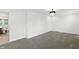 Spacious bedroom with neutral carpet and modern chandelier leading into dining area at 2715 S A St, Elwood, IN 46036