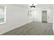 Bedroom featuring neutral carpet, a closet, white walls and ceilings and modern chandelier at 2715 S A St, Elwood, IN 46036