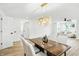 Dining area with stylish chandelier, modern table, and open flow to living areas at 2715 S A St, Elwood, IN 46036