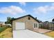 This property includes a detached garage with a concrete driveway and unique patio area and stone veneer at 2715 S A St, Elwood, IN 46036