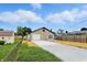 This property includes a detached garage with a concrete driveway and unique patio area and stone veneer at 2715 S A St, Elwood, IN 46036