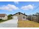 This property includes a detached garage with a concrete driveway and unique patio area and stone veneer at 2715 S A St, Elwood, IN 46036