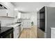 Updated kitchen with white cabinets, stainless steel appliances, and ample counter space at 2715 S A St, Elwood, IN 46036