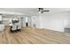 Open-concept living and dining area with hardwood floors and modern white walls at 2715 S A St, Elwood, IN 46036