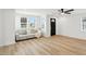 Bright living room featuring hardwood floors, a modern sofa, and plenty of natural light at 2715 S A St, Elwood, IN 46036