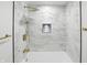 Detailed view of a modern shower with white tile and gold fixtures at 2715 S A St, Elwood, IN 46036