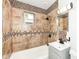 This bathroom features tiled walls, a tub, and a vanity at 2724 N Dearborn St, Indianapolis, IN 46218