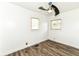 This bedroom features laminate flooring, neutral paint, and two windows at 2724 N Dearborn St, Indianapolis, IN 46218